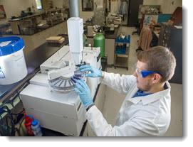 Technician conducting chemical analysis.